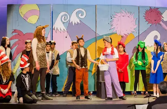 Students performing in theatre