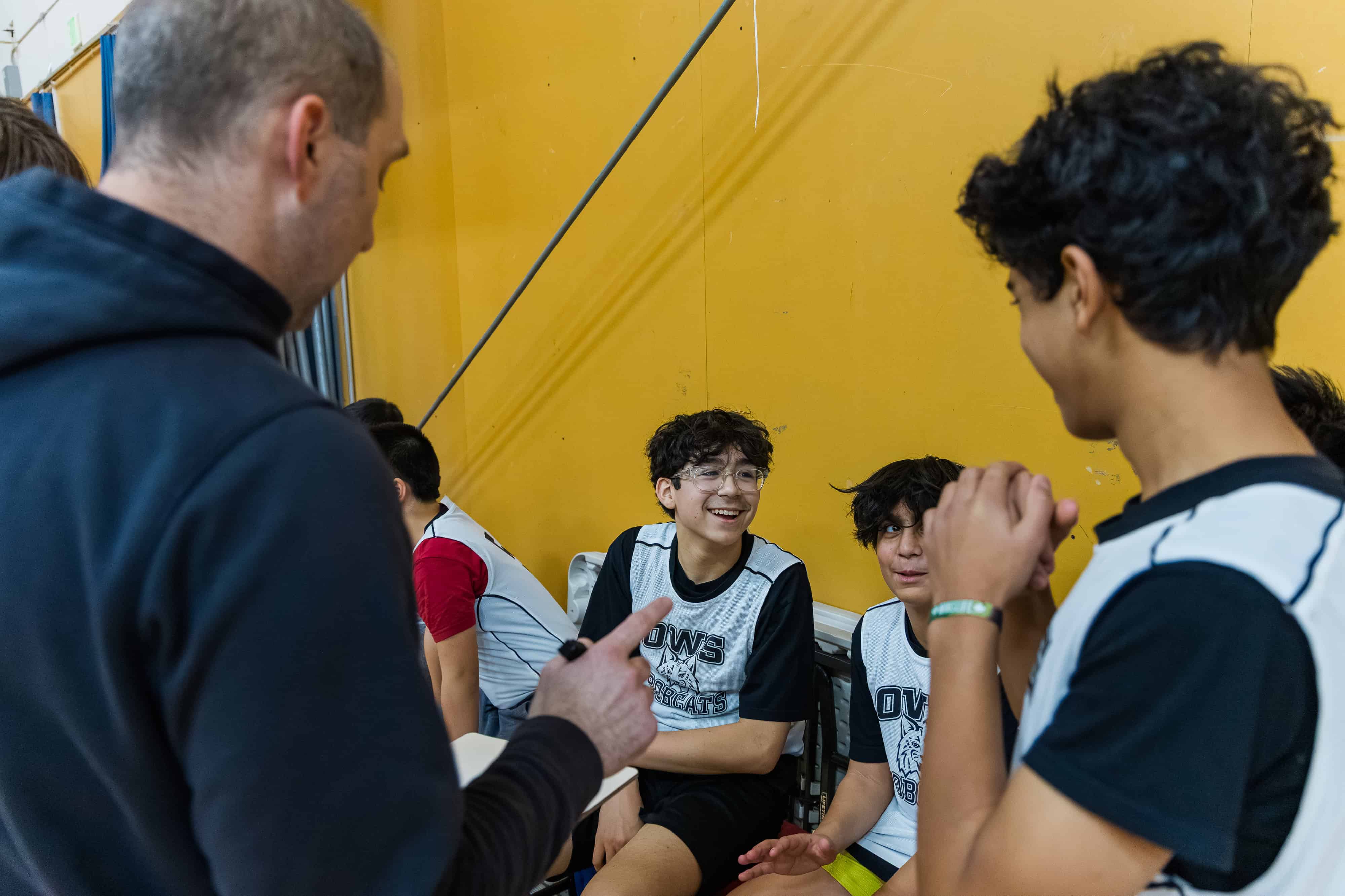 Coach talking to students