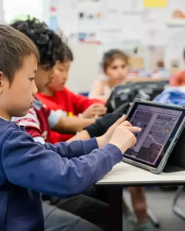 Student working on tablet in class