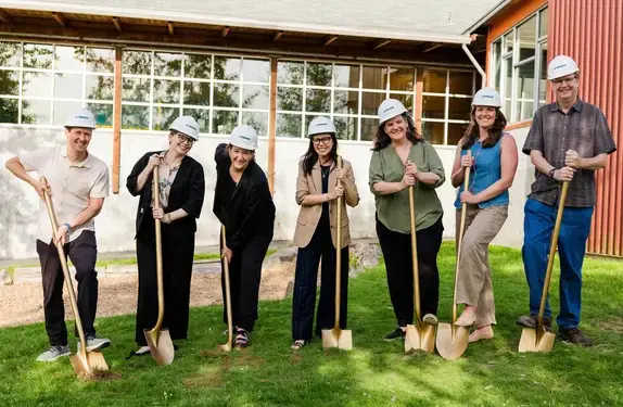 Students digging with shovels