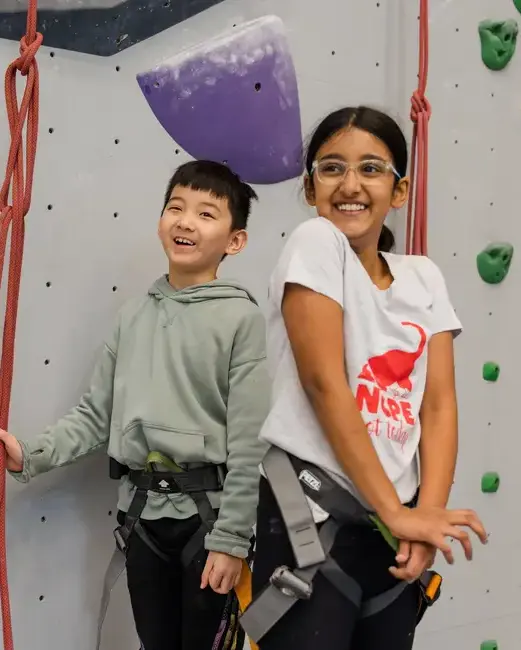 Students in front of rock climbing wall