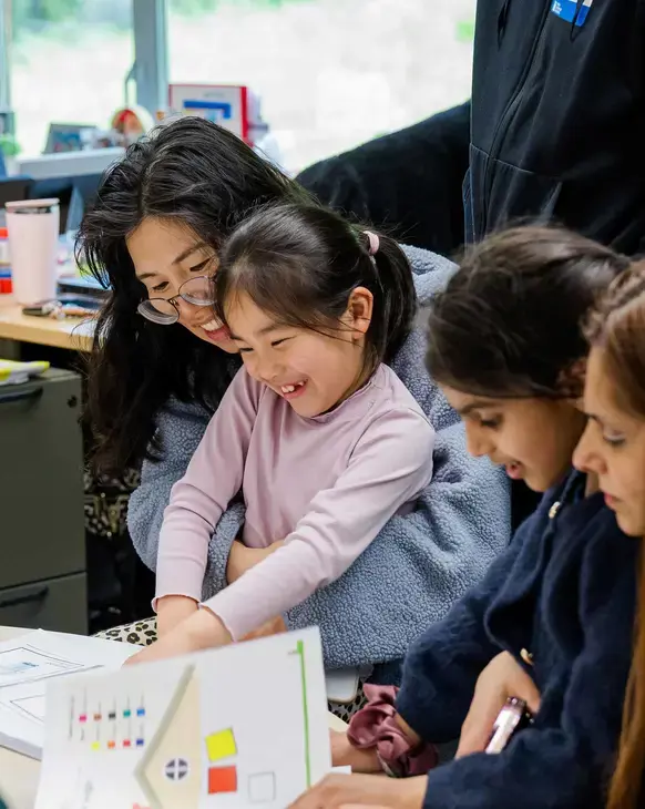 Teachers helping students