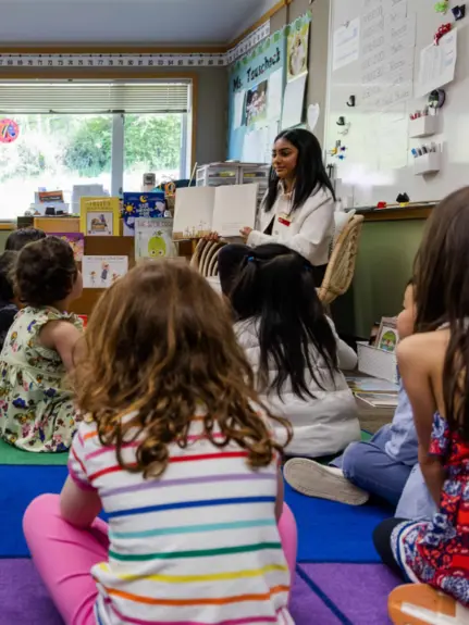Teacher explaining work to students in class