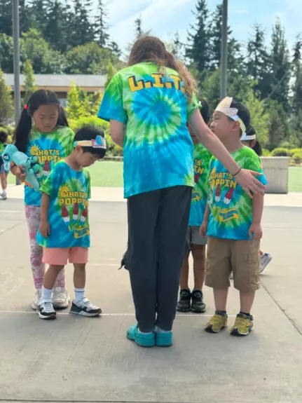 Older student leading younger group of students
