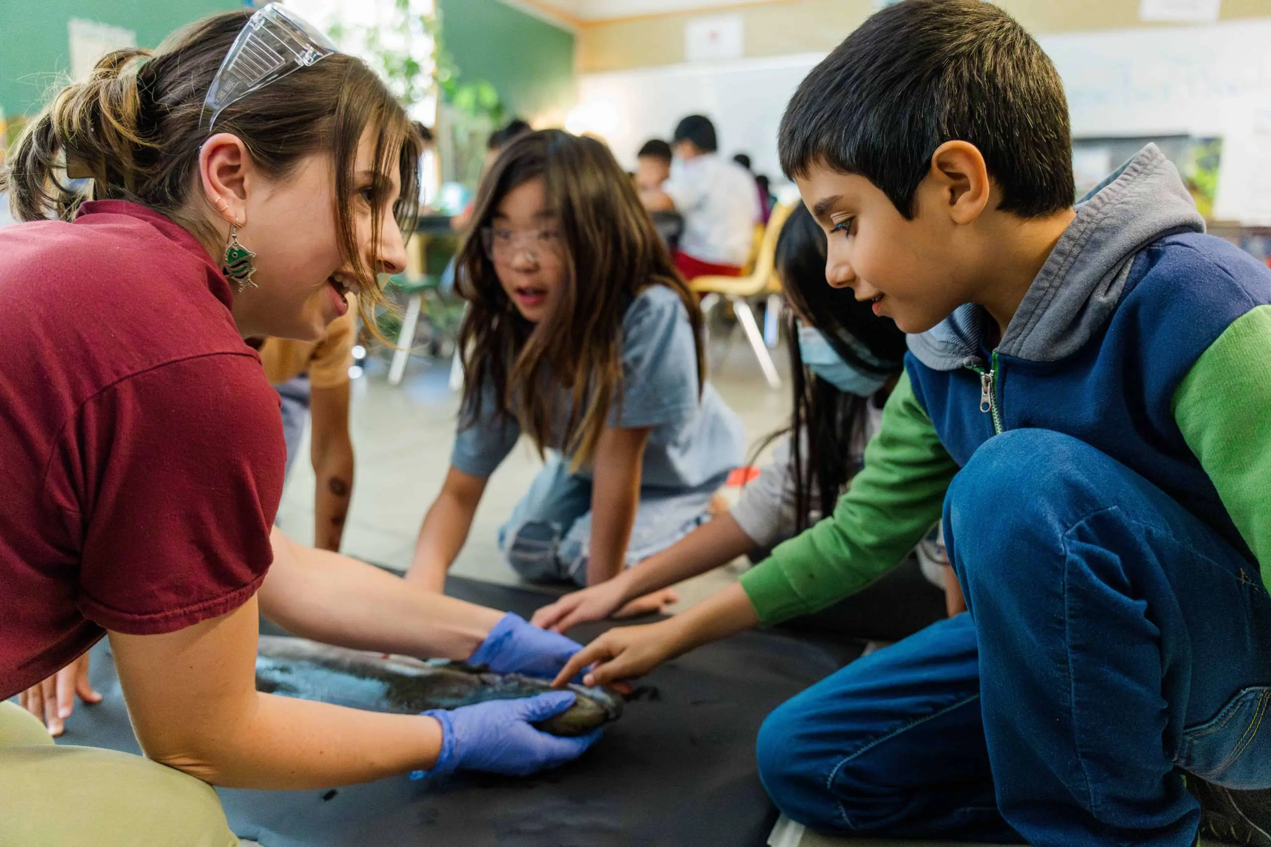 Teacher showing student fossil