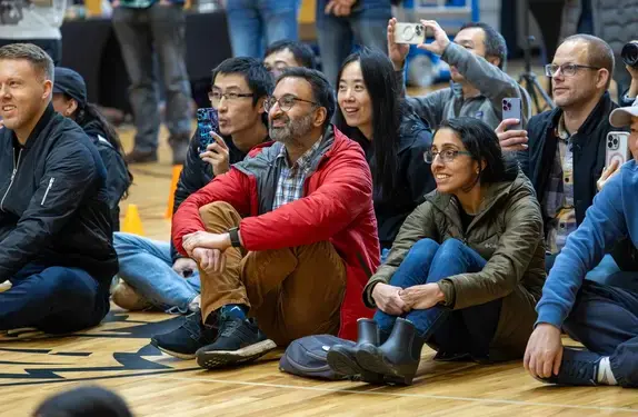 Parent sitting with student in hall