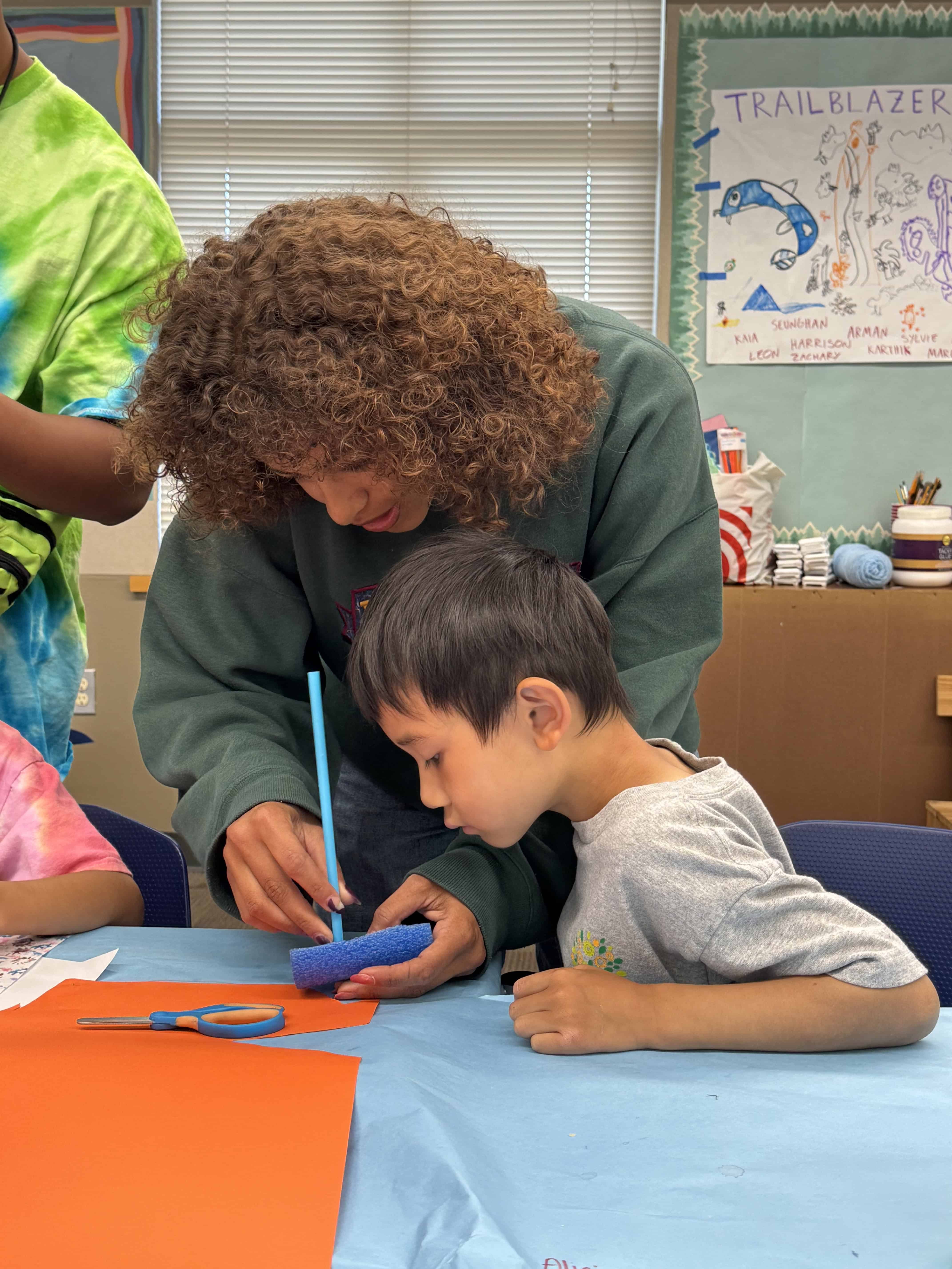 Teacher helping student with work