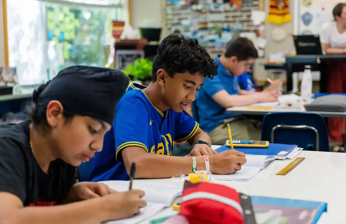 Students working on math paper