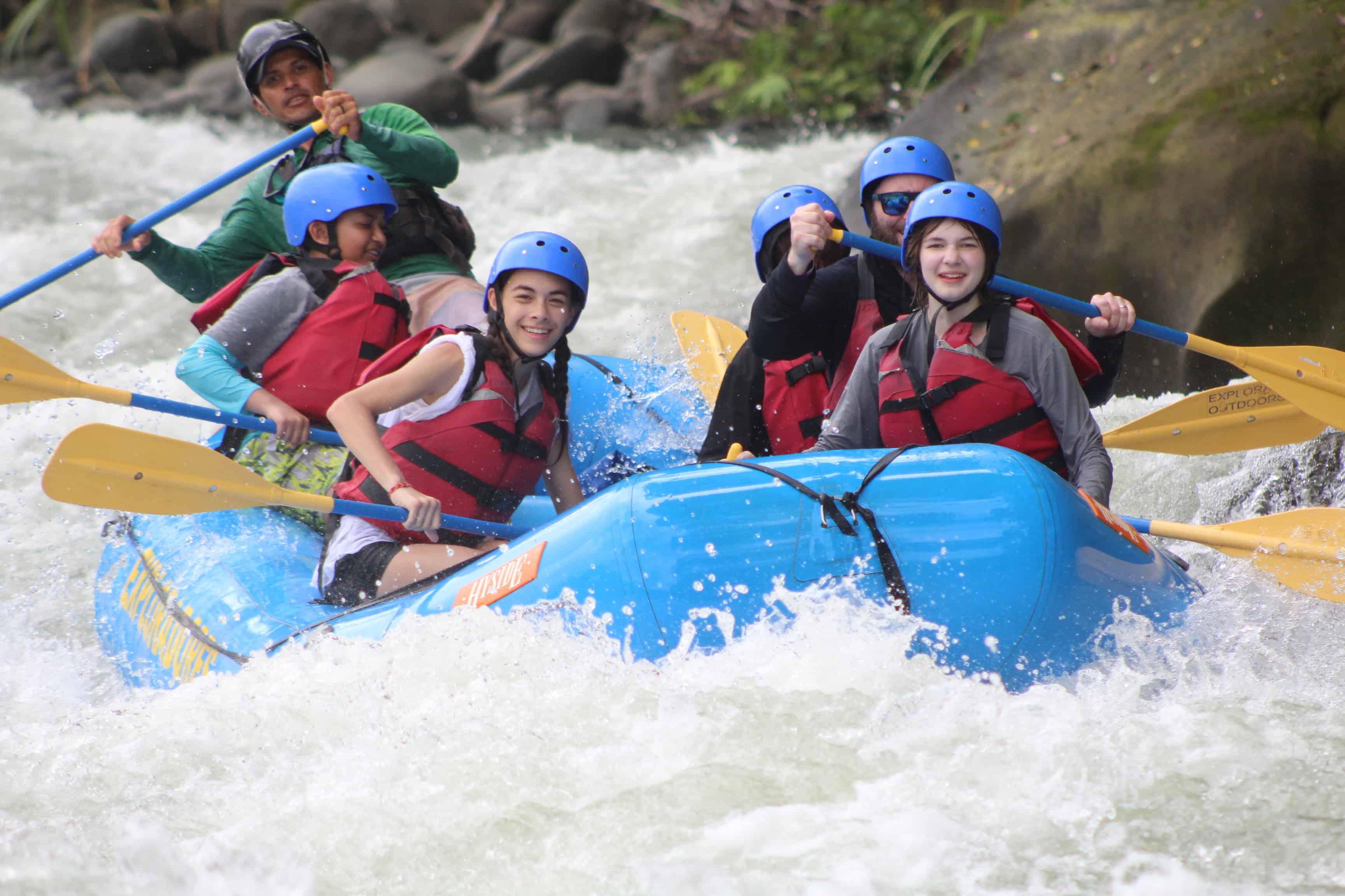 Students on a boat in the rapids