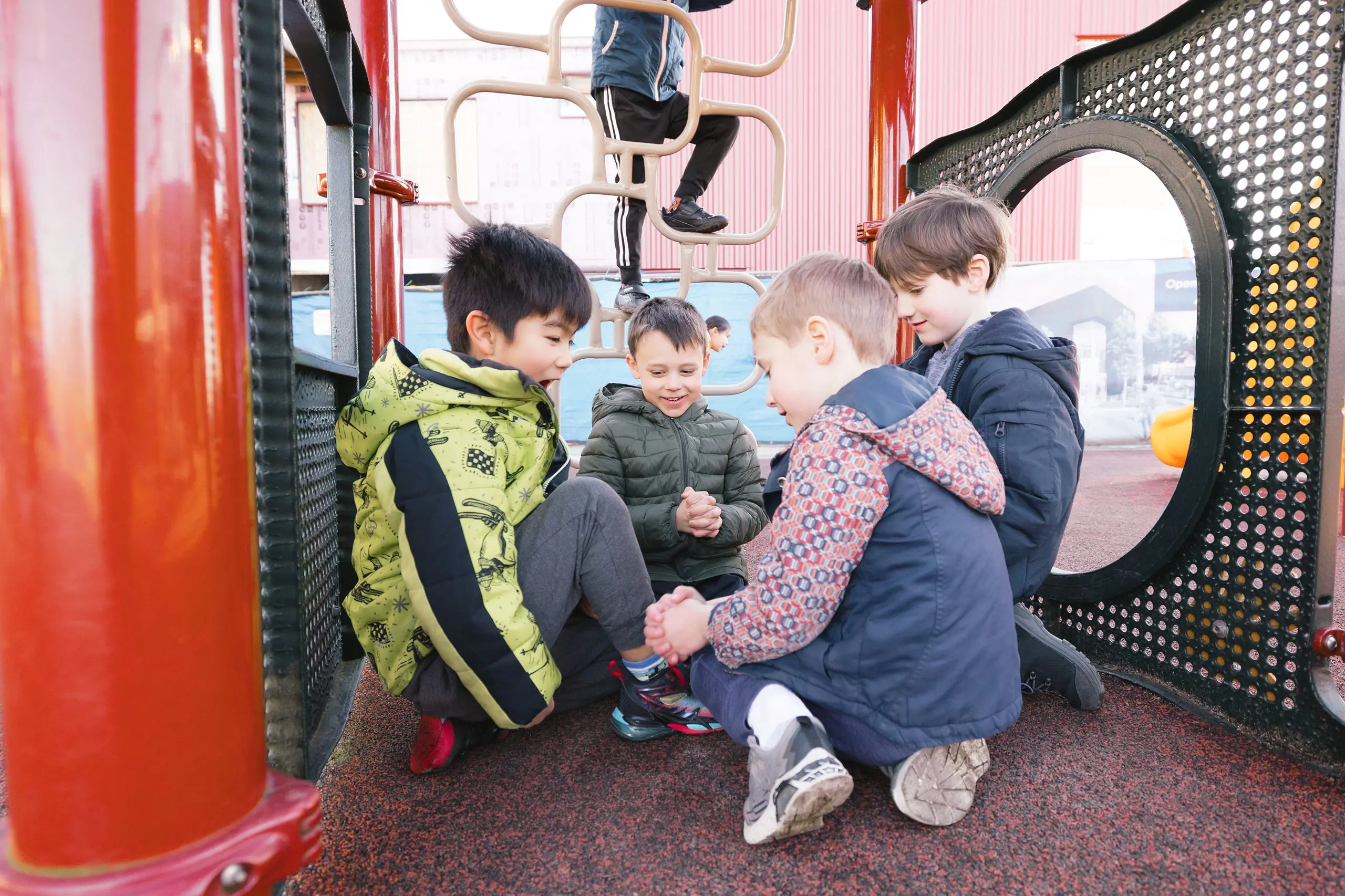 Students playing on climbing frame 